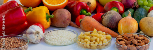 Set of basic healthy eating ingredients: vegetables, grains, and nuts with copy space