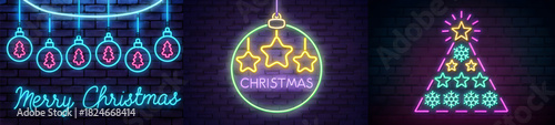 Neon christmas decorations on a brick wall with christmas tree ornaments and merry christmas text