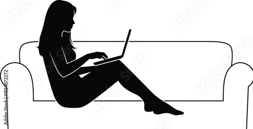Silhouette of a woman sitting on a couch using a laptop