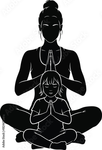 Silhouette of a mother and child meditating together