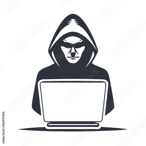 Dark silhouette of hooded hacker actively using laptop while facing forward intently on white