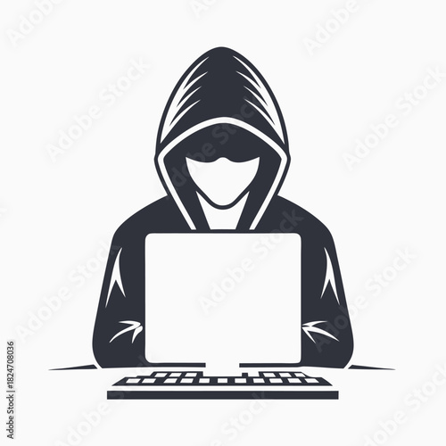 Anonymous hooded character sits at a computer while coding, completely shadowed from view