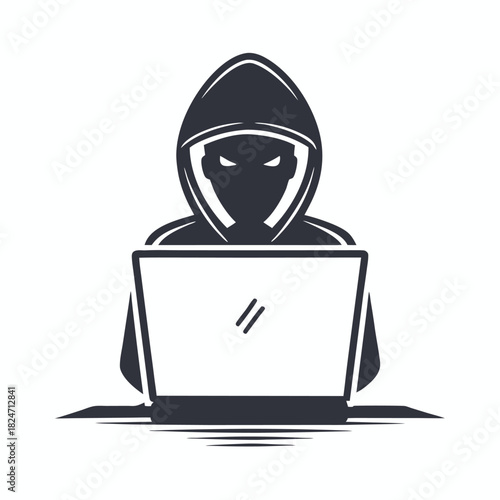 Dark hooded hacker using a laptop exhibits an intense, focused, criminal demeanor