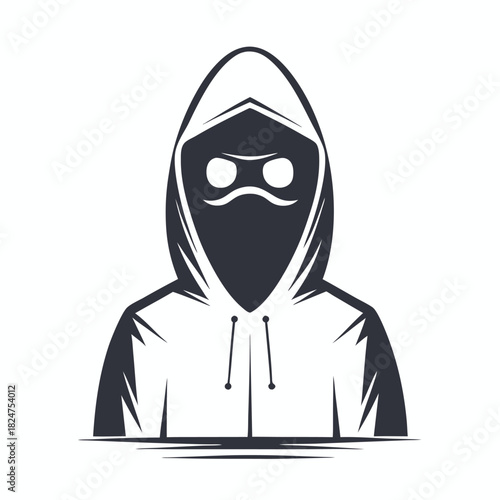 Dark silhouette of a hooded figure conceals the face with a mask for anonymity