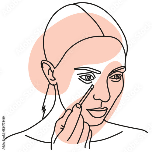 Woman applying makeup with a brush