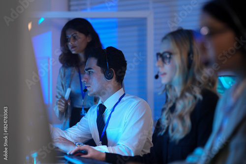 Quadro em tela Command center lead focused intense monitoring critical systems late night heads
