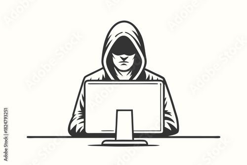 Person in hoodie sits before computer screen looking intently at the display