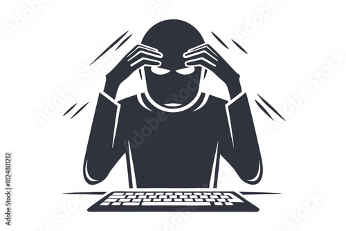 Stressed hacker sitting at a computer with hands on his head appears overwhelmed