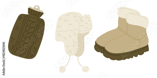 Cozy winter accessories including a knitted hot water bottle cover, a fluffy hat and warm boots are shown in a soft minimal style. The concept conveys warmth, comfort and seasonal essentials