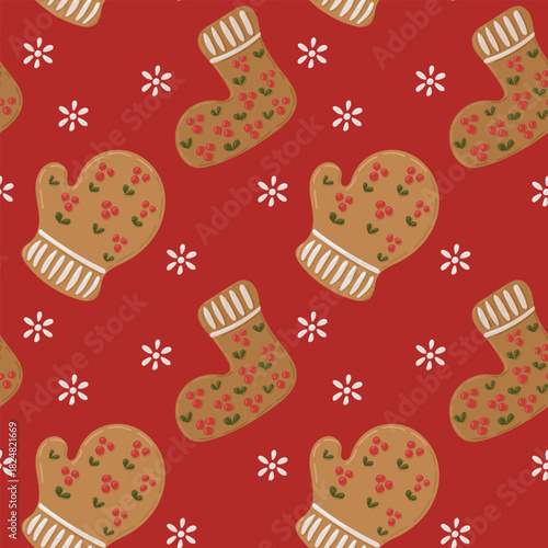 Gingerbread mittens and socks with floral icing form a seamless festive pattern on a red background. The concept represents cozy christmas spirit, holiday baking and warm seasonal decor