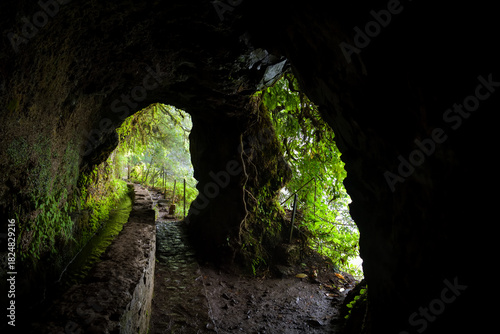 Small tunnel with two openings on Levada do Caldeirao Verde trail in Maderia
