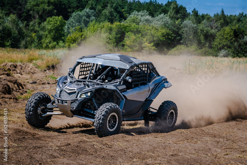 UTV buggy, rally or 4x4 in the action on sand