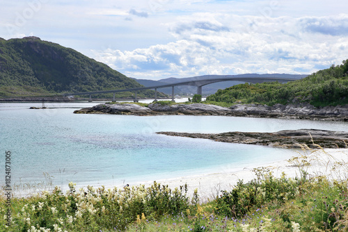 Stunning and idyllic Sommaroya islands landscape by the turquoise sea with white sand beaches. Atlantic shore near Sommarøy, Norway.