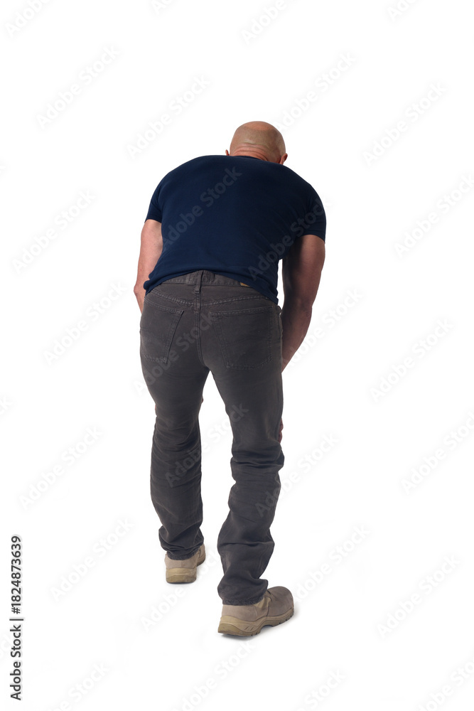 Naklejka premium back view of a man standing leaning forward look down on white background