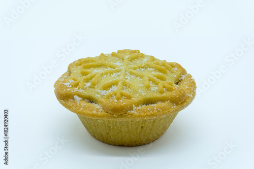 Christmas mince pie covered in sugar and filled with sweet mince filling.