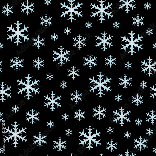 
A seamless vector pattern of pale blue snowflakes on a black background. Perfect for holiday-themed prints.