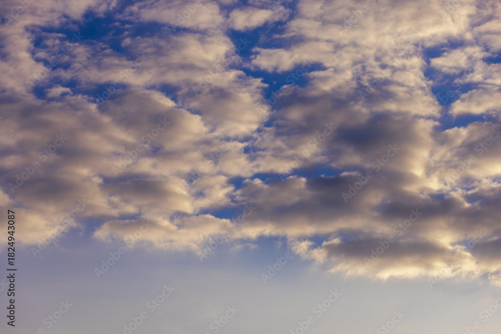 Fototapeta premium Cloudy sky with textured clouds and soft light.