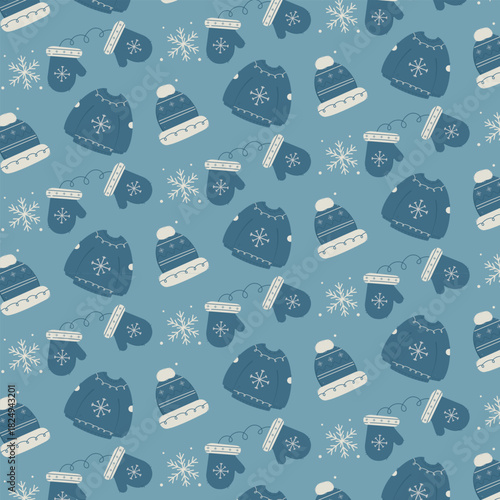Cozy winter seamless pattern featuring hand-drawn sweaters, knitted hats, warm mittens and snowflakes on a soft blue background. 