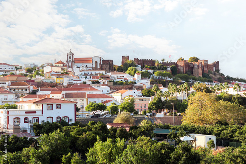 View of the old town of Silves with historic buildings, the old cathedral and the Castelo de Silves, Portimao region, Algarve Portugal