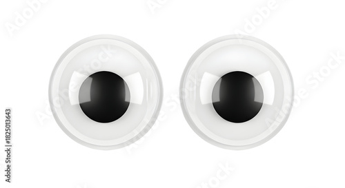 Close-up of two googly eyes with black pupils and white sclera on a white background, isolated studio shot