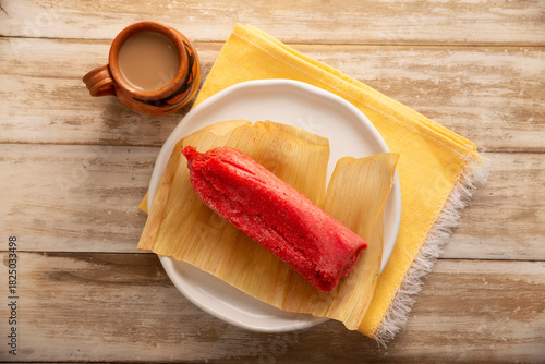 Sweet Tamale. hispanic dish typical of Mexico and some Latin American countries. Corn dough wrapped in corn leaves. The tamales are steamed. Usually accompanied with atole, hot chocolate or coffee