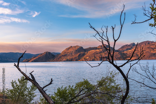 Sunset view of Okanagan Mountain Park and Okanagan Lake