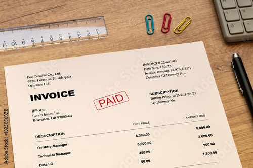 Fototapeta Naklejka Na Ścianę i Meble -  There is a document with the word INVOICE. It is as an eye-catching image.