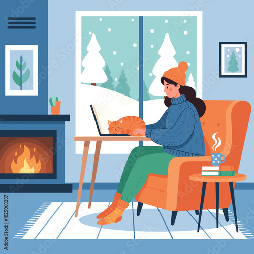 Young female freelancer in cozy mood working on laptop with sleeping cat against snowy window and fireplace backdrop in winter home interior