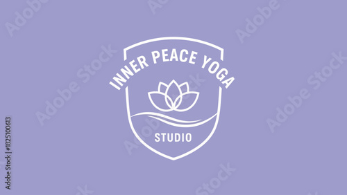 A lavender background with a white emblem featuring text, lotus, and a curved line