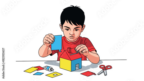 A child making a paper house, using scissors, glue and colorful paper, at a table