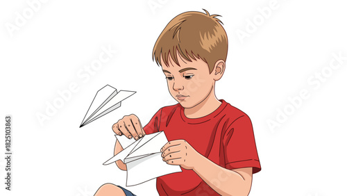 A young boy focused on folding a piece of paper, crafting a paper airplane