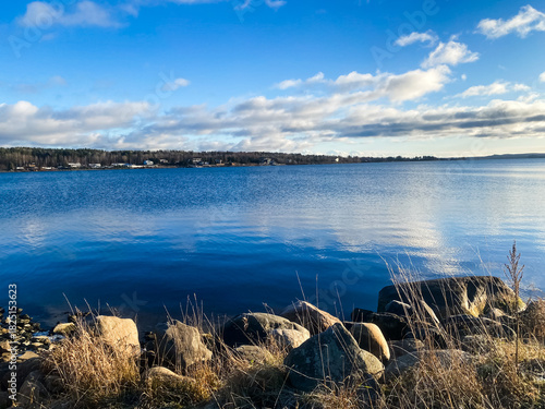Winter landscape. The shore of Lake Onega covered with the first ice. Karelia	

