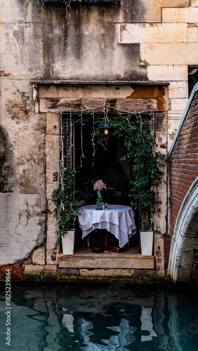 Classic Venice scenery featuring canals, boats, bridges and timeless Italian architecture in a peaceful, picturesque setting.
