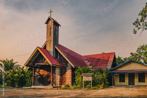 Wooden Catholic Church with red roof in Jempang Village, East Kalimantan, Indonesia