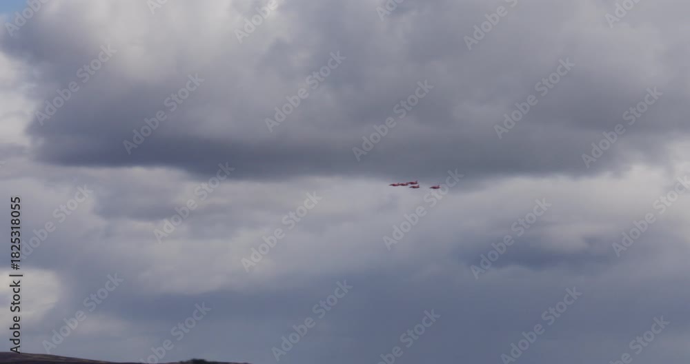 Shot of five Royal Air Force red arrows planes flying over the countryside at angus glens and Glen Clova Valley