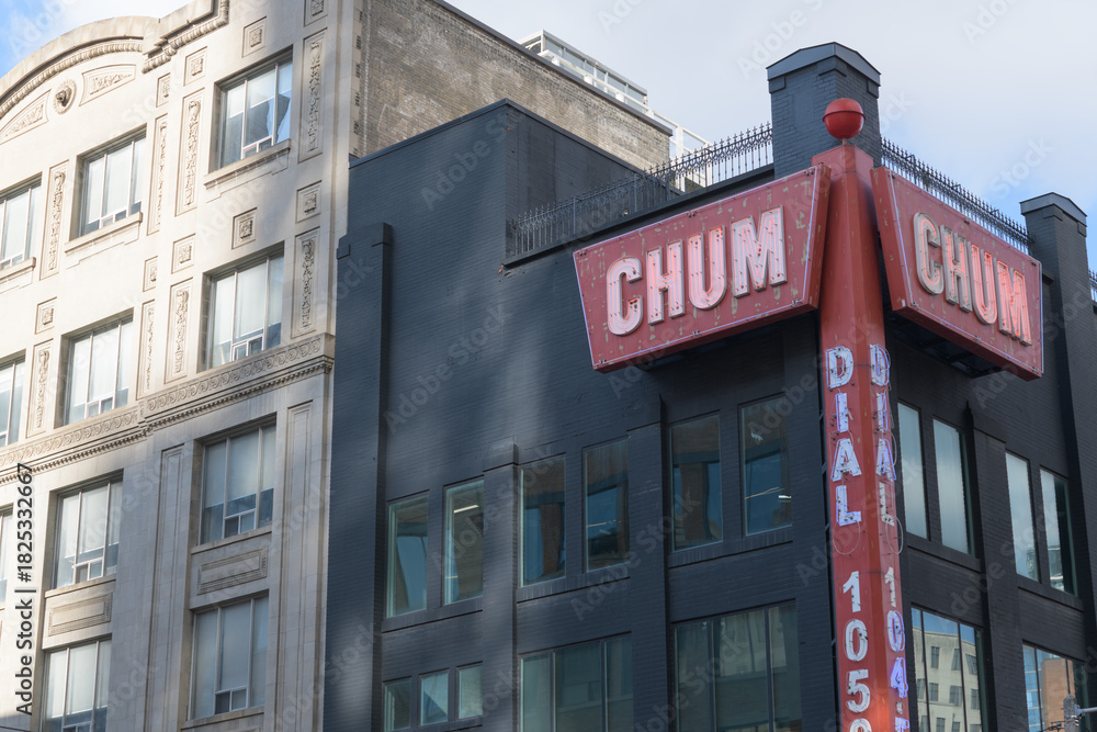 Fototapeta premium vintage neon sign of CHUM 104.5 located at 299 Queen St W (installed at northwest corner of Richmond and Duncan), Toronto