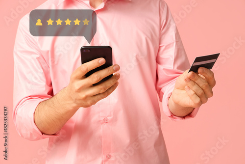 Young businessman with mobi...
