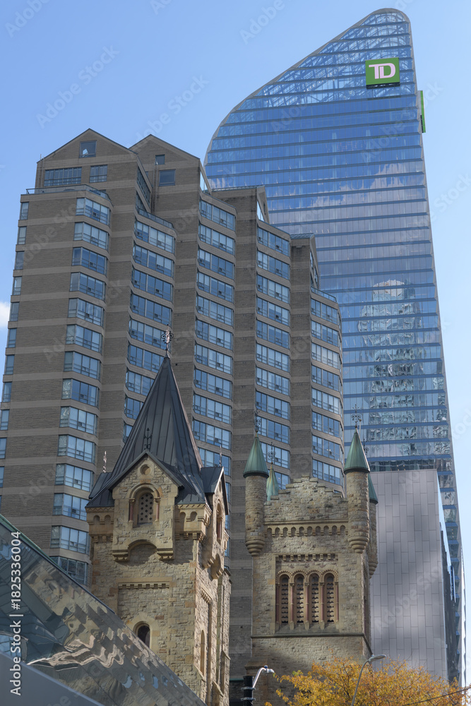 Obraz premium St. Andrew's Presbyterian Church, residential apartment building, and TD Terrace, or looking southeast from King St W to Simcoe St, Toronto