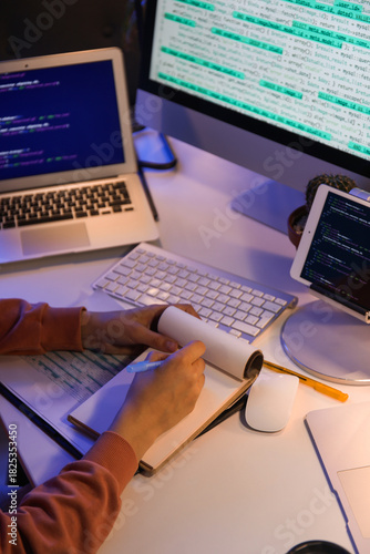 Software developer coding o...