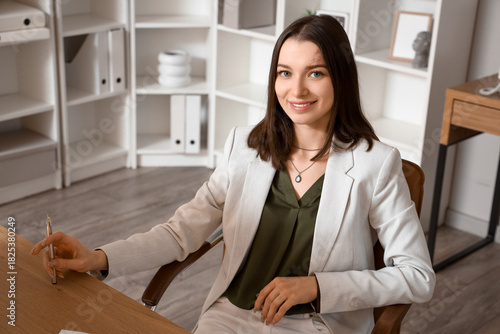 Young businesswoman sitting...