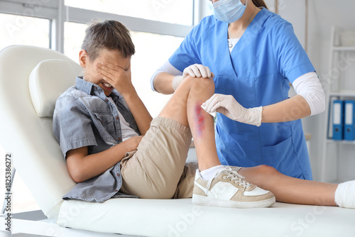 Little boy with bruised leg...