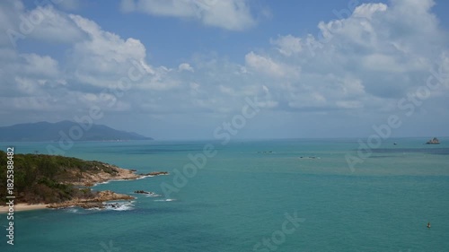 Tropical beautiful landscape of sea ocean around sand with white cloud blue sky for nature background
