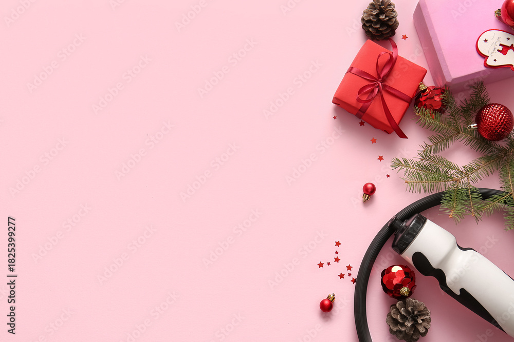 Obraz premium Composition with sports equipment, Christmas gift and decorations on pink background