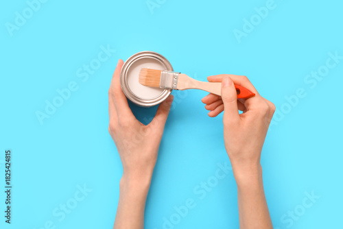 Female hands with can of wh...