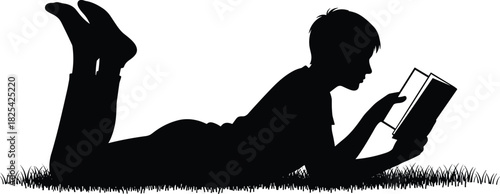 Black silhouette of a young boy reading a book while lying on his stomach in the grass, vector illustration drawing isolated on white background
