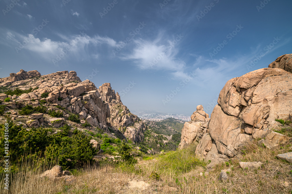 Fototapeta premium Beautiful rock formation against the blue sky in Dazhu Mountain Scenic Area in Qingdao Shandong Province, China