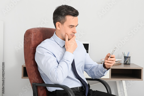 Thoughtful young businessma...