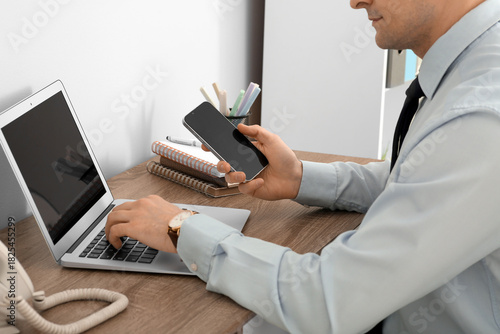 Businessman using modern mo...