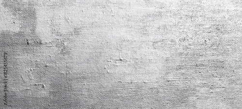 Close-up of rough textured gray concrete wall surface with drywall finish and subtle cracks and unevenness