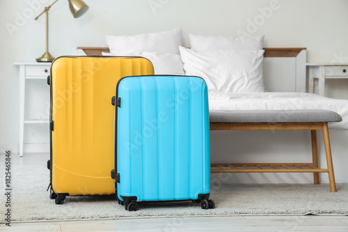 Suitcases on carpet in hote...